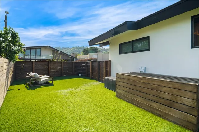 an aerial view of residential houses with city view