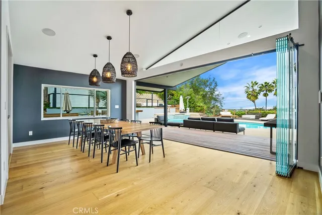 a view of a dining room with furniture window and wooden floor