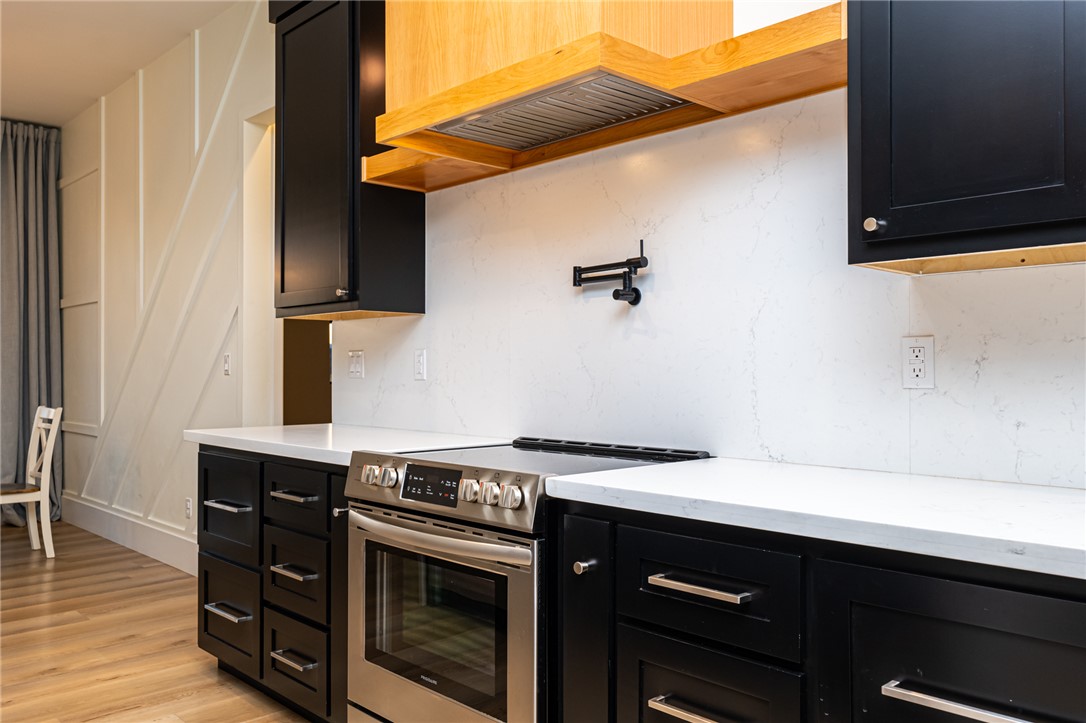 3783 Ramsey Road Bullhead City, AZ 86442 - Photo 11 of 56 a kitchen with a stove and a microwave