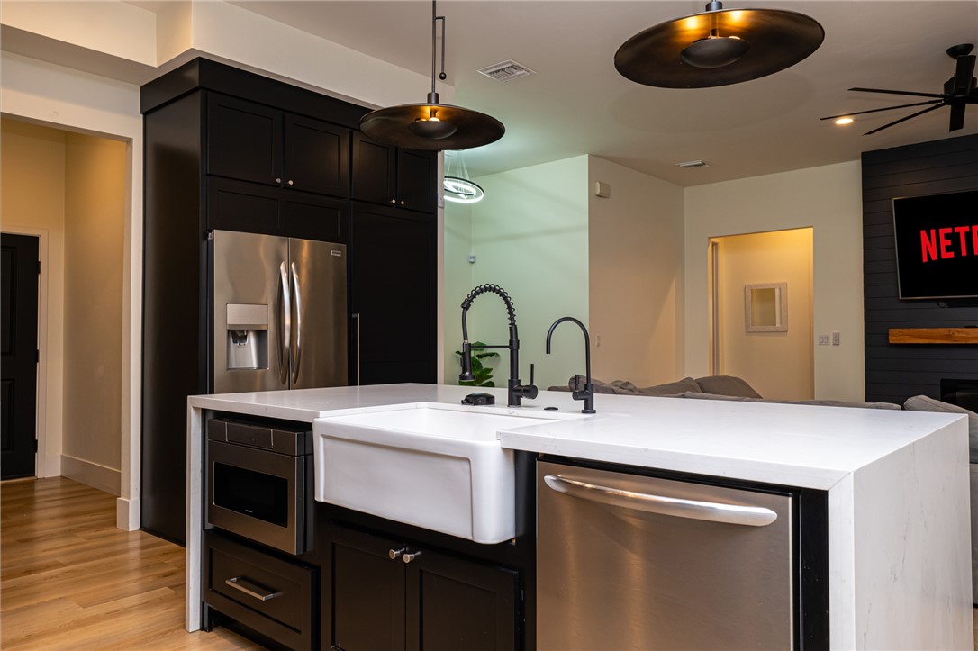 3783 Ramsey Road Bullhead City, AZ 86442 - Photo 12 of 56 a kitchen with a sink a counter space and cabinets