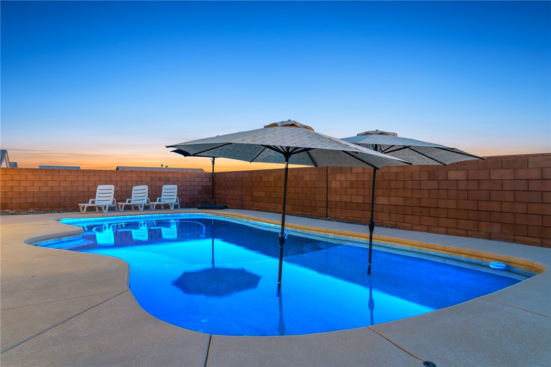 3783 Ramsey Road Bullhead City, AZ 86442 - Photo 2 of 56 a view of a swimming pool with a lounge chairs