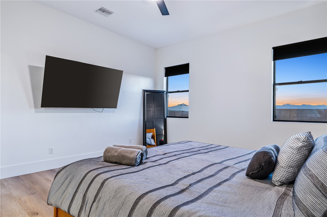 3783 Ramsey Road Bullhead City, AZ 86442 - Photo 21 of 56 a bedroom with a bed and a flat screen tv