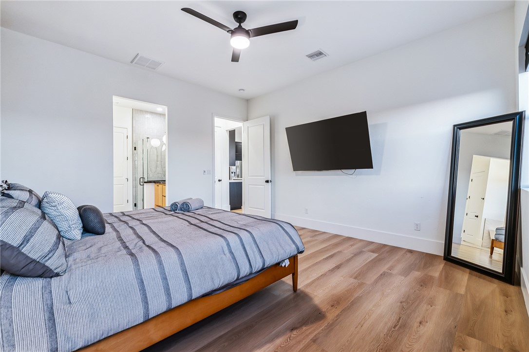3783 Ramsey Road Bullhead City, AZ 86442 - Photo 22 of 56 a bedroom with a bed and a flat screen tv