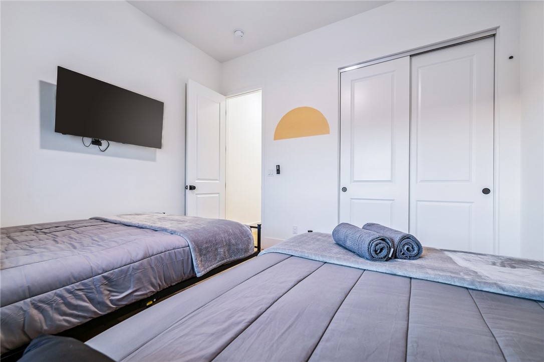 3783 Ramsey Road Bullhead City, AZ 86442 - Photo 39 of 56 a bedroom with a bed and a flat screen tv