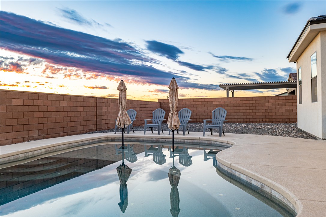 3783 Ramsey Road Bullhead City, AZ 86442 - Photo 49 of 56 Pool at dusk with a patio area and a fenced backyard