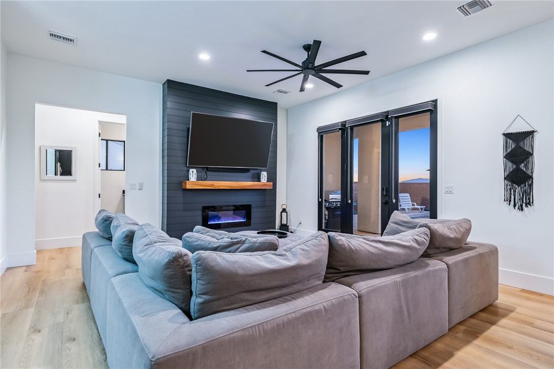 3783 Ramsey Road Bullhead City, AZ 86442 - Photo 7 of 56 a living room with furniture and a flat screen tv