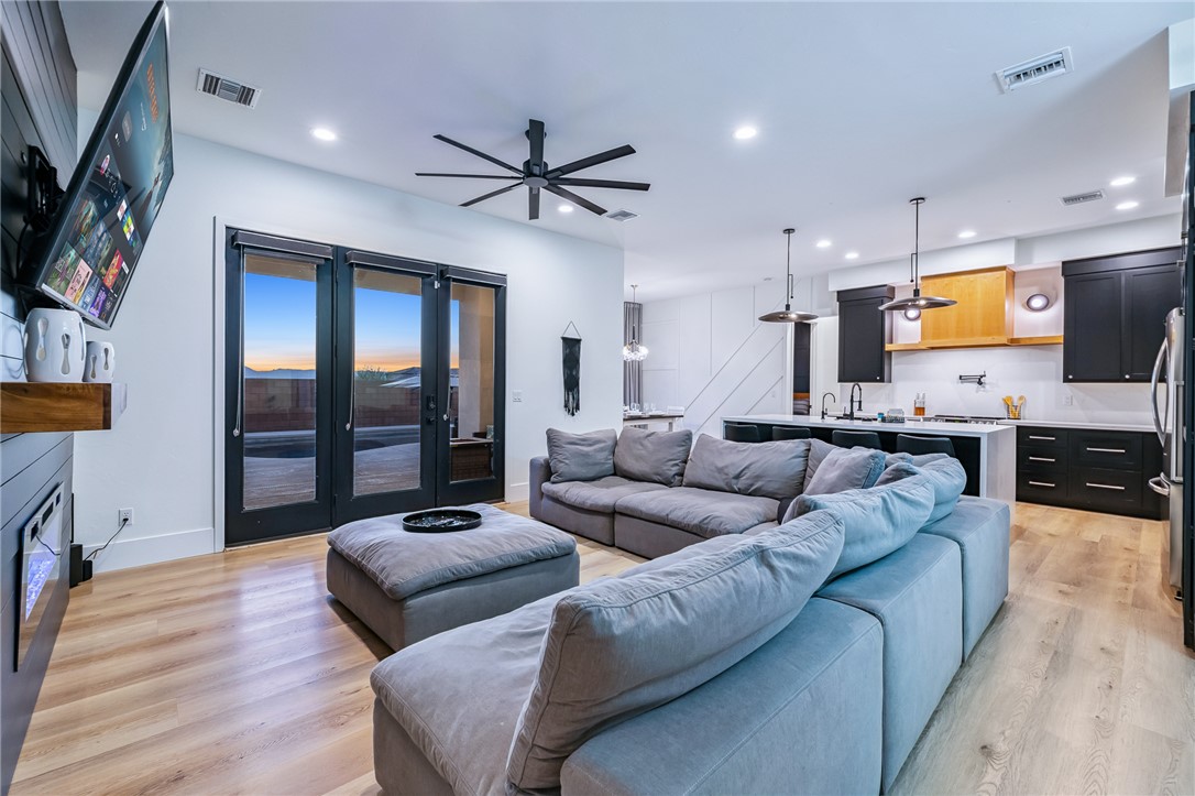 3783 Ramsey Road Bullhead City, AZ 86442 - Photo 8 of 56 a living room with furniture and a flat screen tv