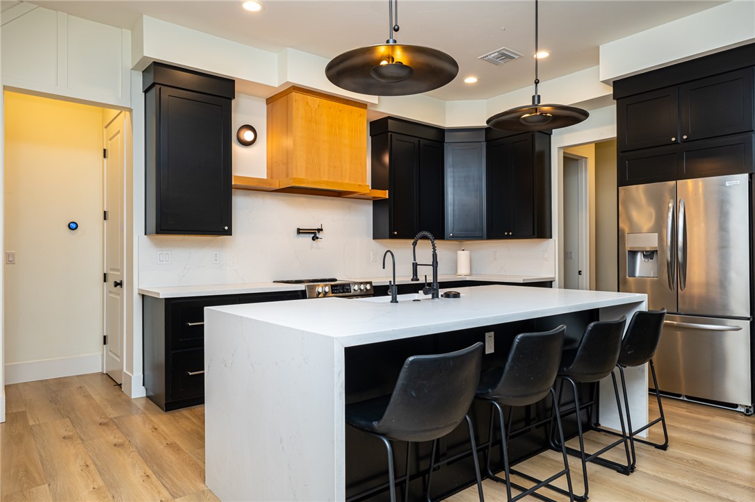 3783 Ramsey Road Bullhead City, AZ 86442 - Photo 9 of 56 a kitchen with stainless steel appliances a stove a refrigerator and microwave