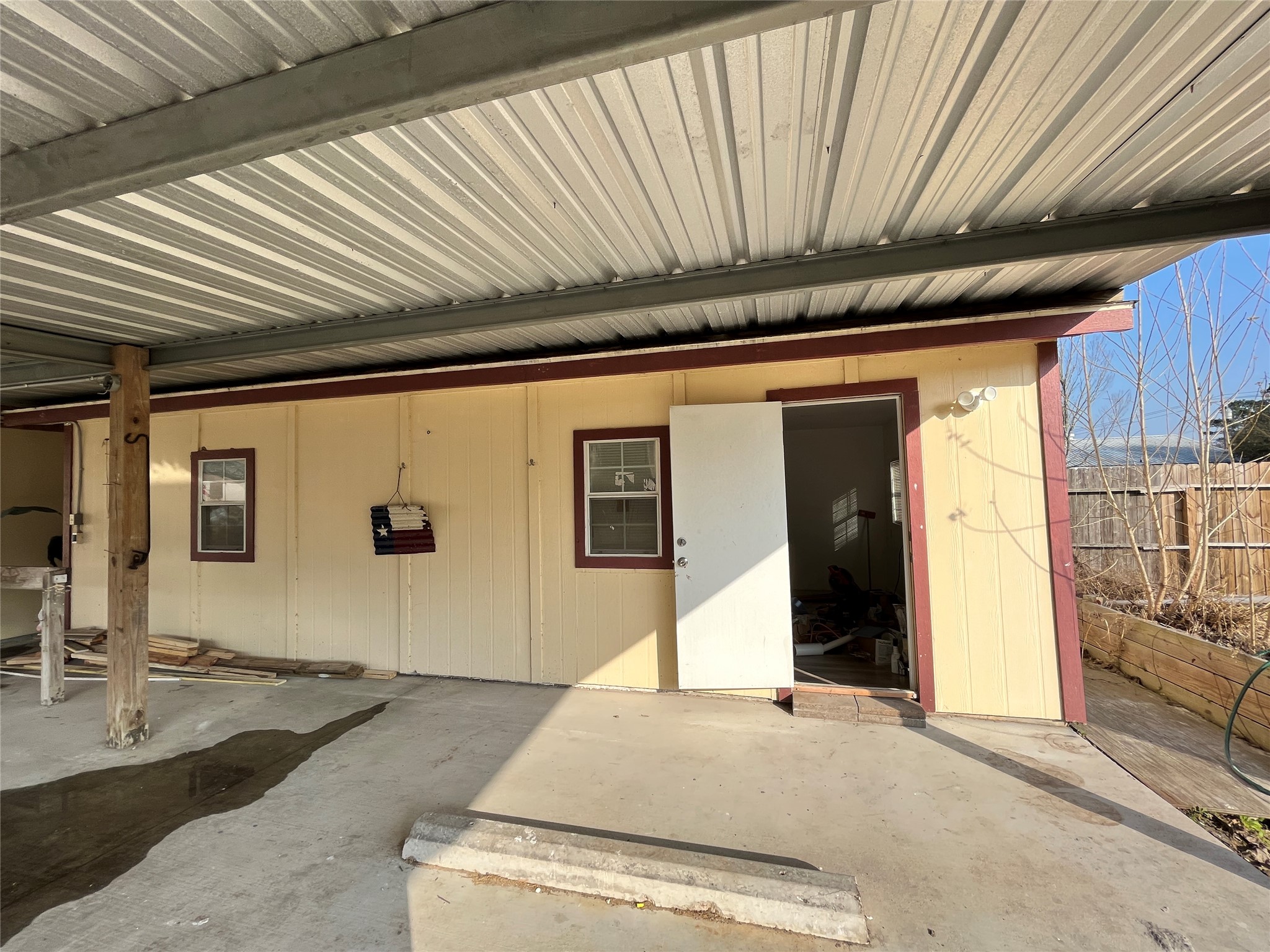 a front view of a house with basket ball court and outdoor seating