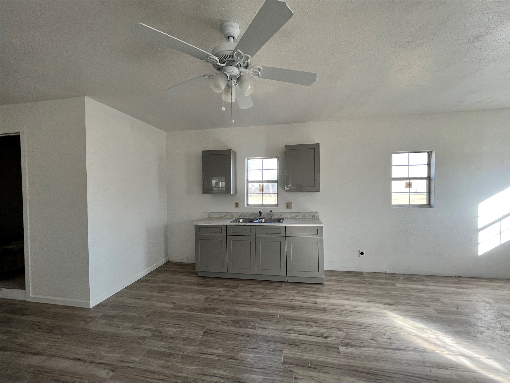 5104 39th Street East, Unit 4 Dickinson, TX 77539 - Photo 4 of 7 a view of a kitchen with microwave and cabinets