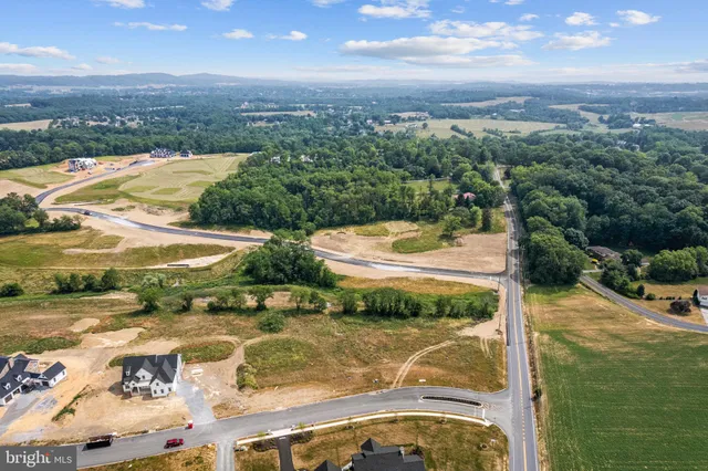 a view of a lake with a yard