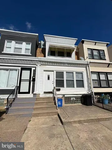 a front view of a building with many windows