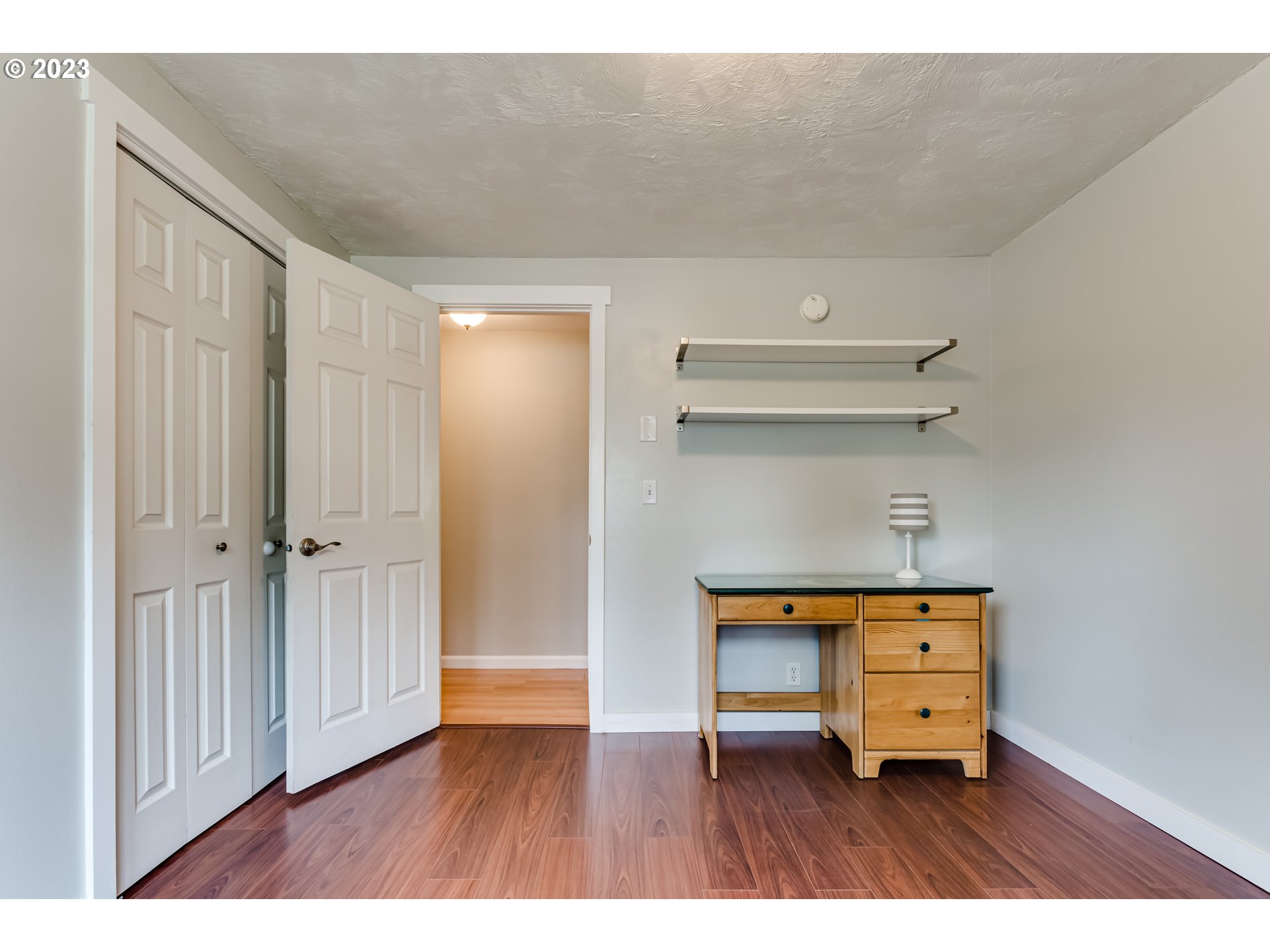 6973 Glacier Drive Springfield, OR 97478 - Photo 18 of 34 view of room with wooden floor