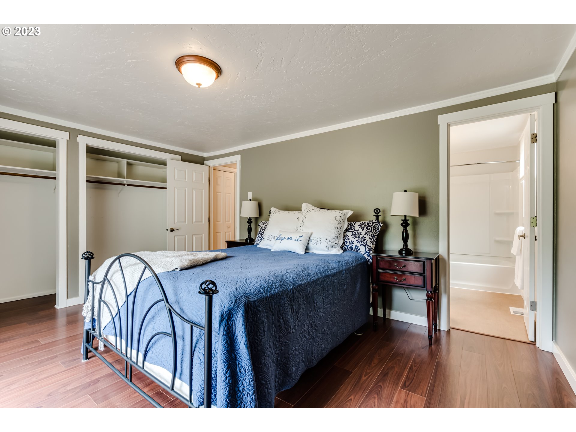 6973 Glacier Drive Springfield, OR 97478 - Photo 26 of 34 a bedroom with a bed and a table