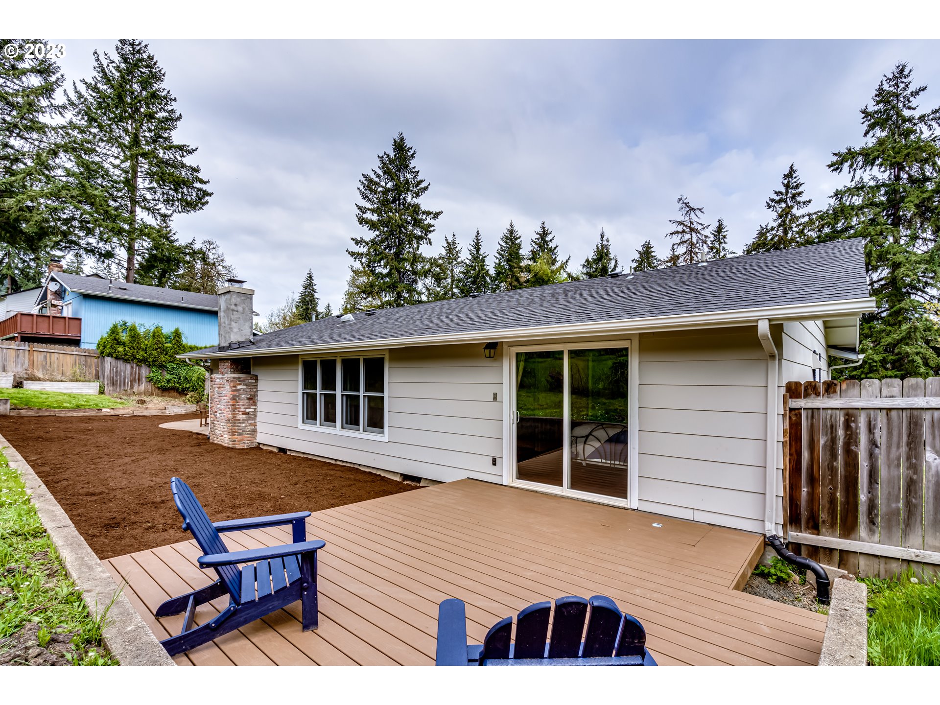 6973 Glacier Drive Springfield, OR 97478 - Photo 30 of 34 a view of a house with backyard and sitting area