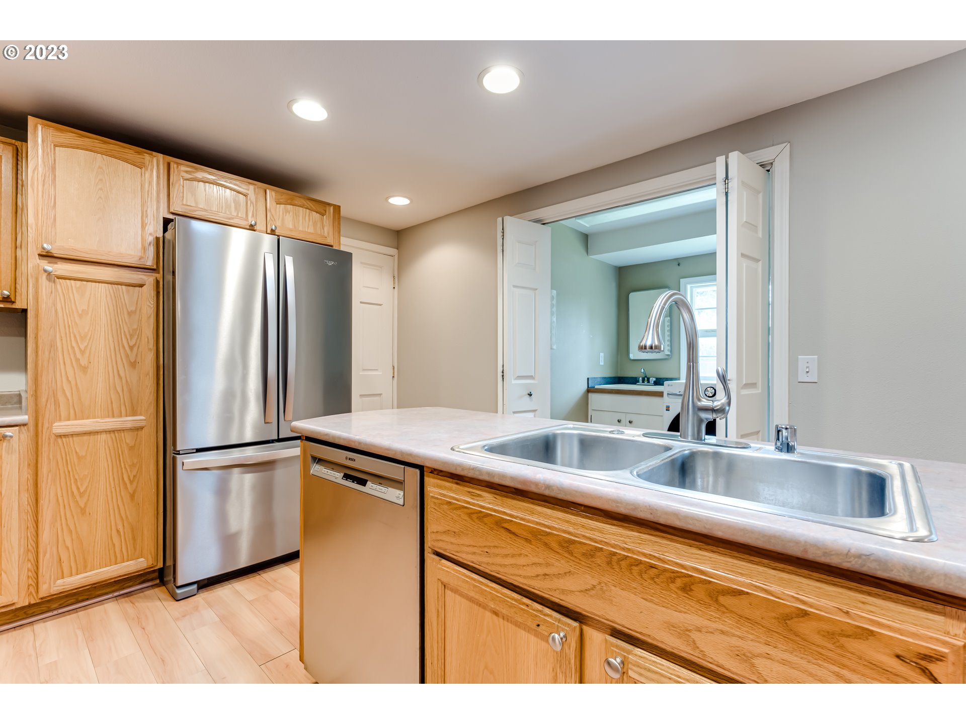 6973 Glacier Drive Springfield, OR 97478 - Photo 9 of 34 a kitchen with stainless steel appliances granite countertop a refrigerator and a sink