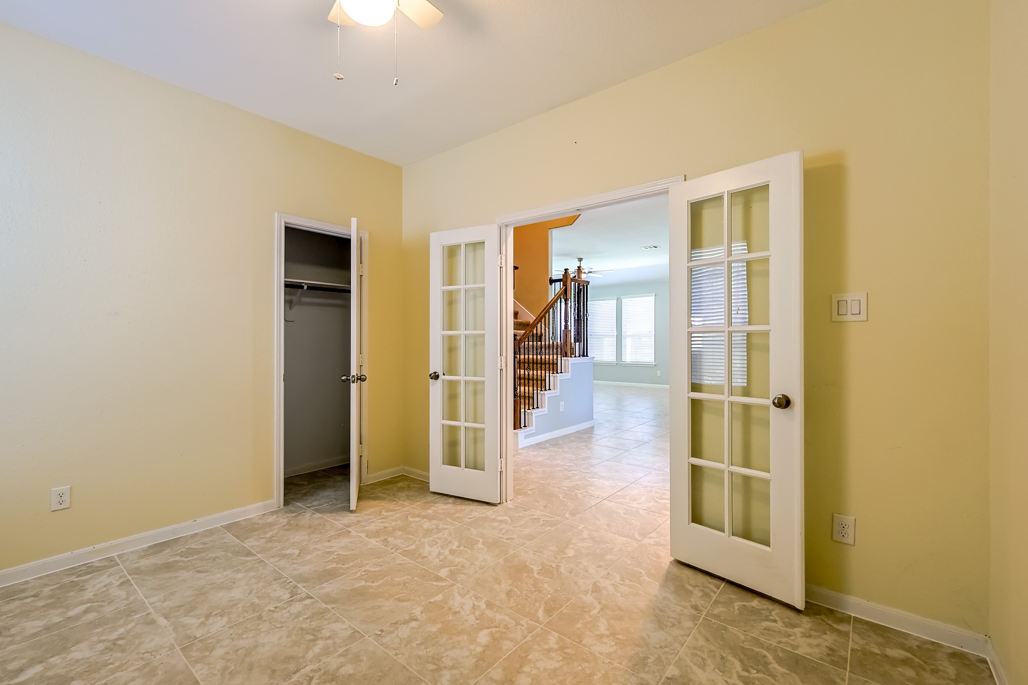 6014 Watford Bend Rosenberg, TX 77471 - Photo 23 of 36 a view of a hallway with wooden shelves
