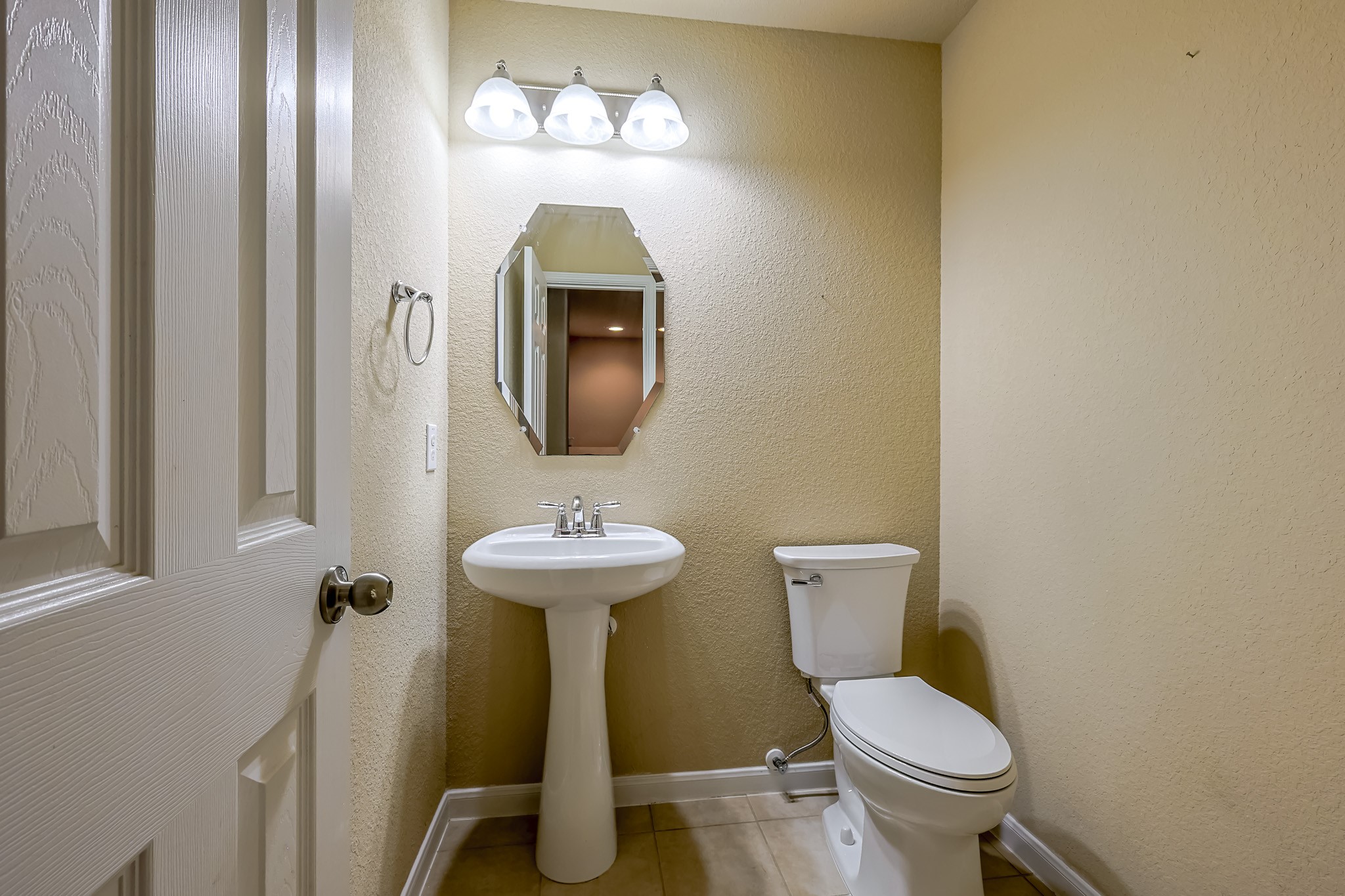 6014 Watford Bend Rosenberg, TX 77471 - Photo 32 of 36 a bathroom with a toilet sink and mirror