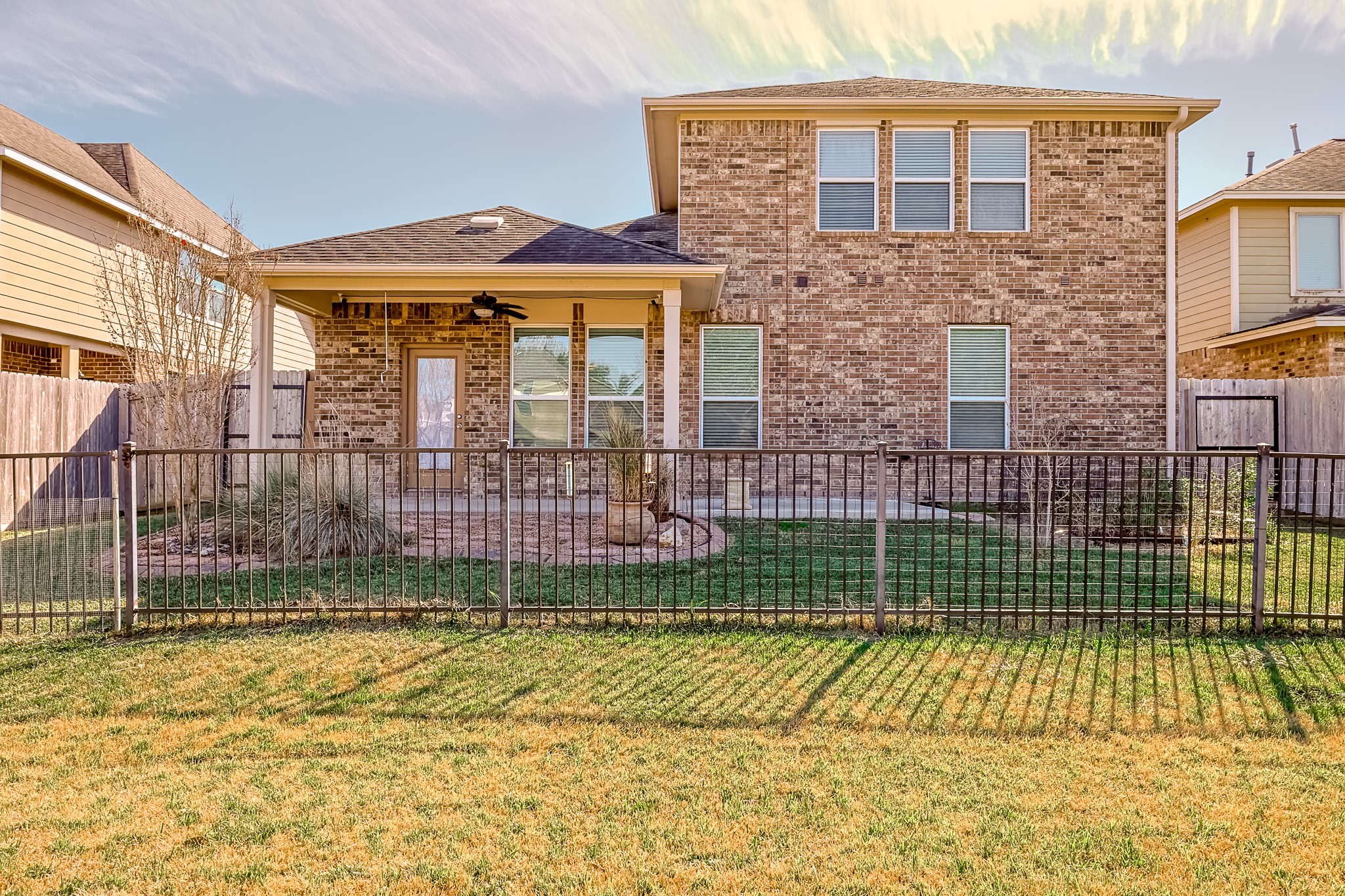 6014 Watford Bend Rosenberg, TX 77471 - Photo 34 of 36 a view of a brick house with a swimming pool