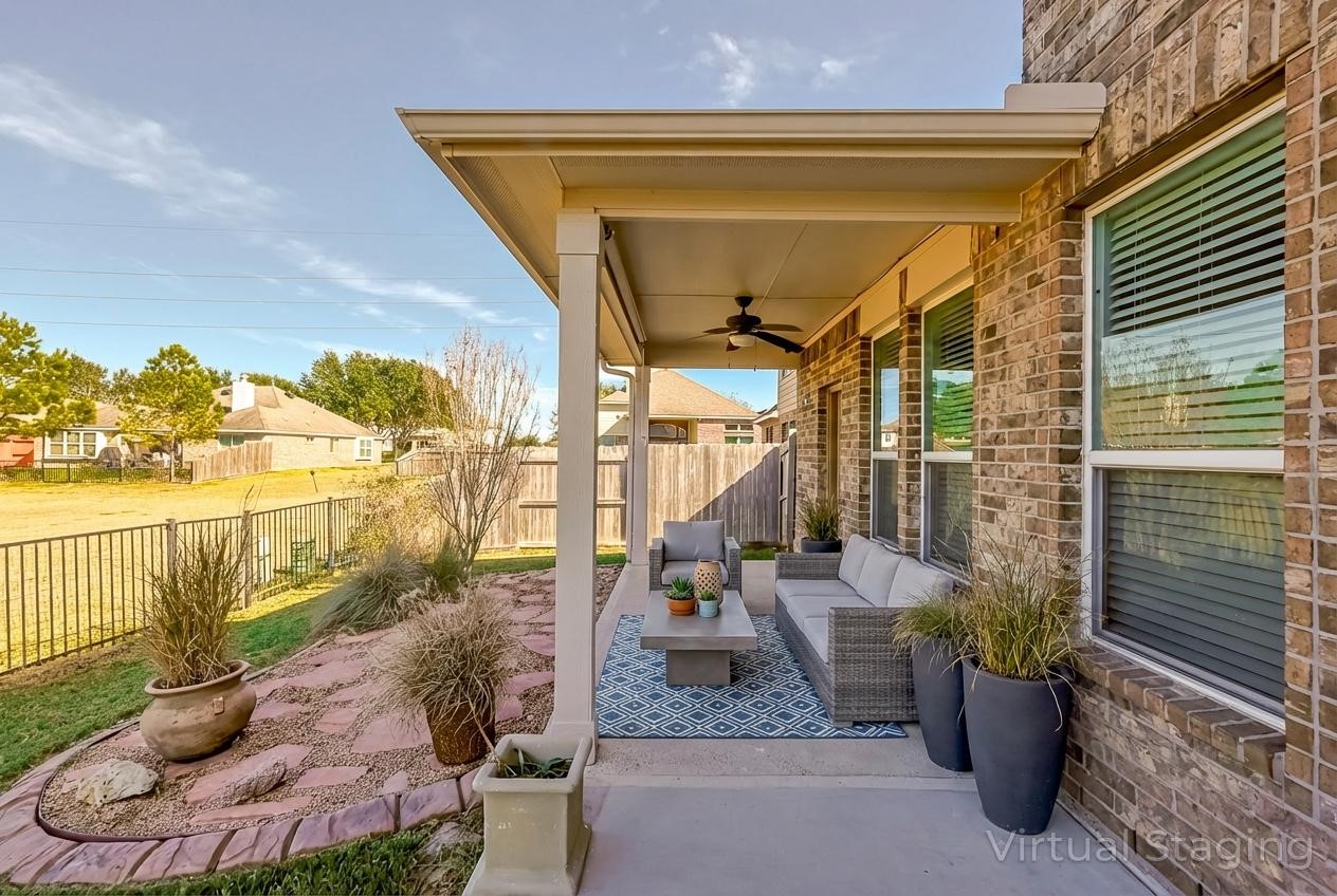 6014 Watford Bend Rosenberg, TX 77471 - Photo 35 of 36 a view of a porch with furniture and floor to ceiling window