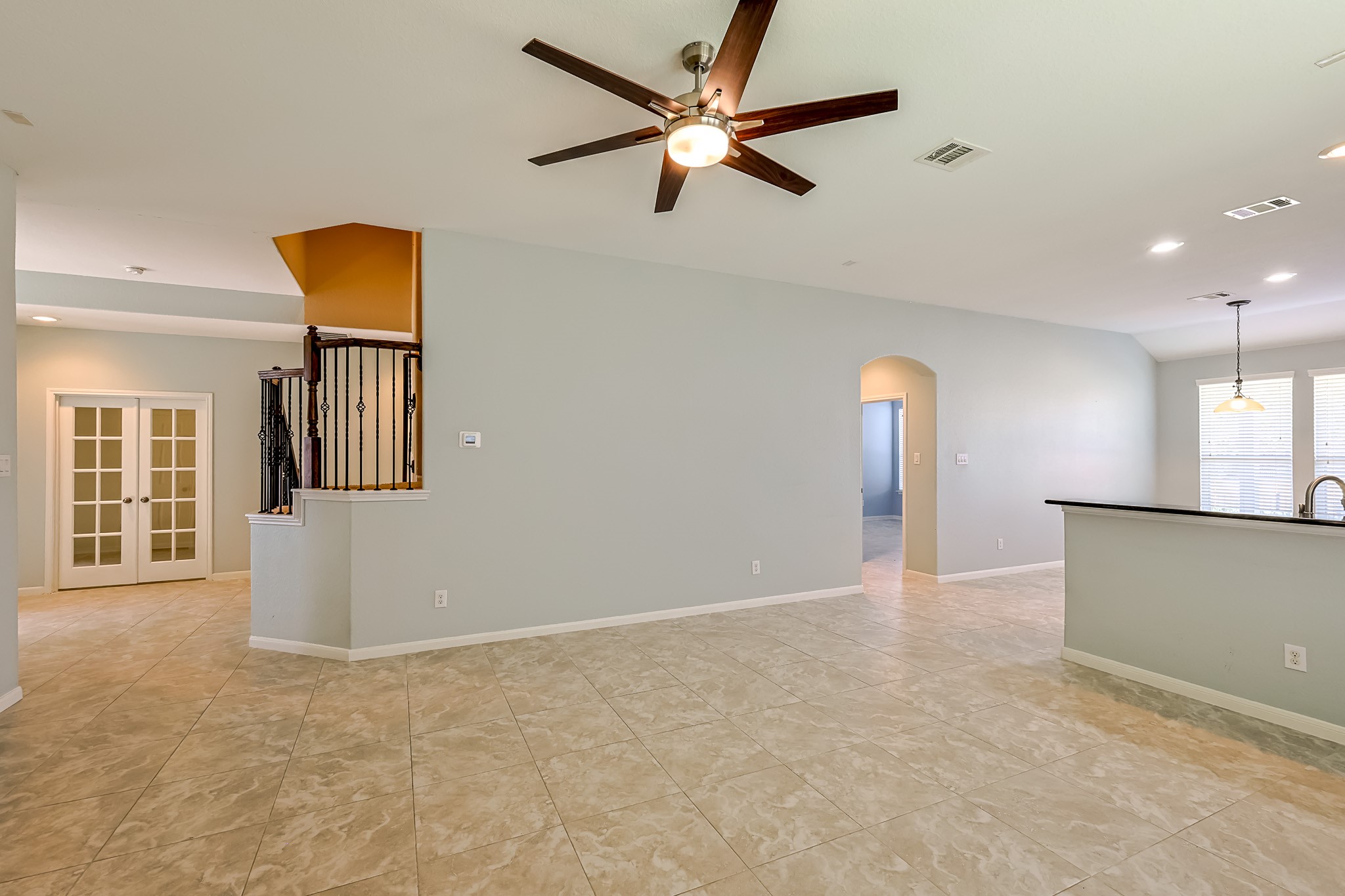 6014 Watford Bend Rosenberg, TX 77471 - Photo 6 of 36 a view of an empty room with window and a kitchen