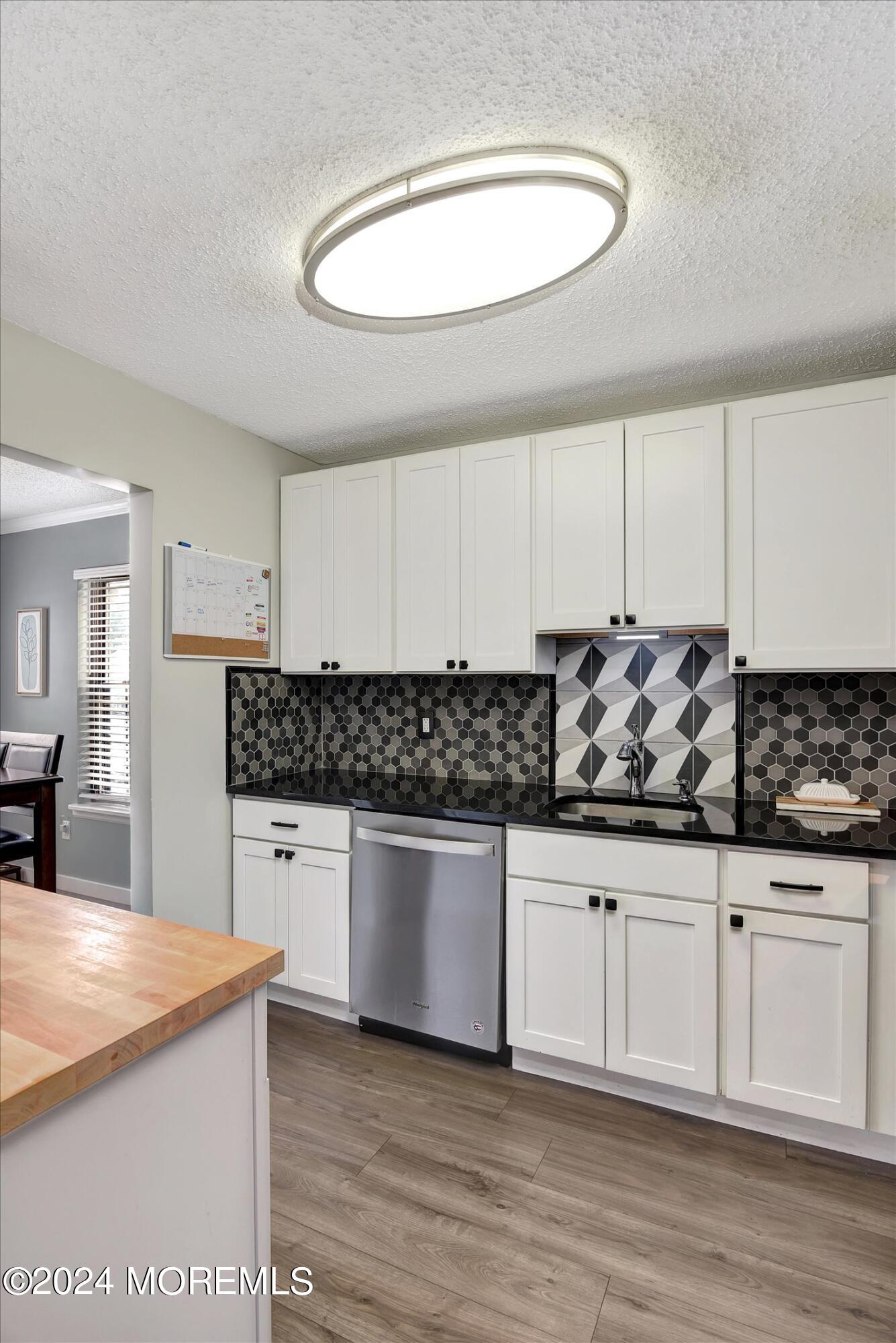 116 Azalea Circle Jackson, NJ 08527 - Photo 18 of 37 a kitchen with stainless steel appliances granite countertop a sink and cabinets