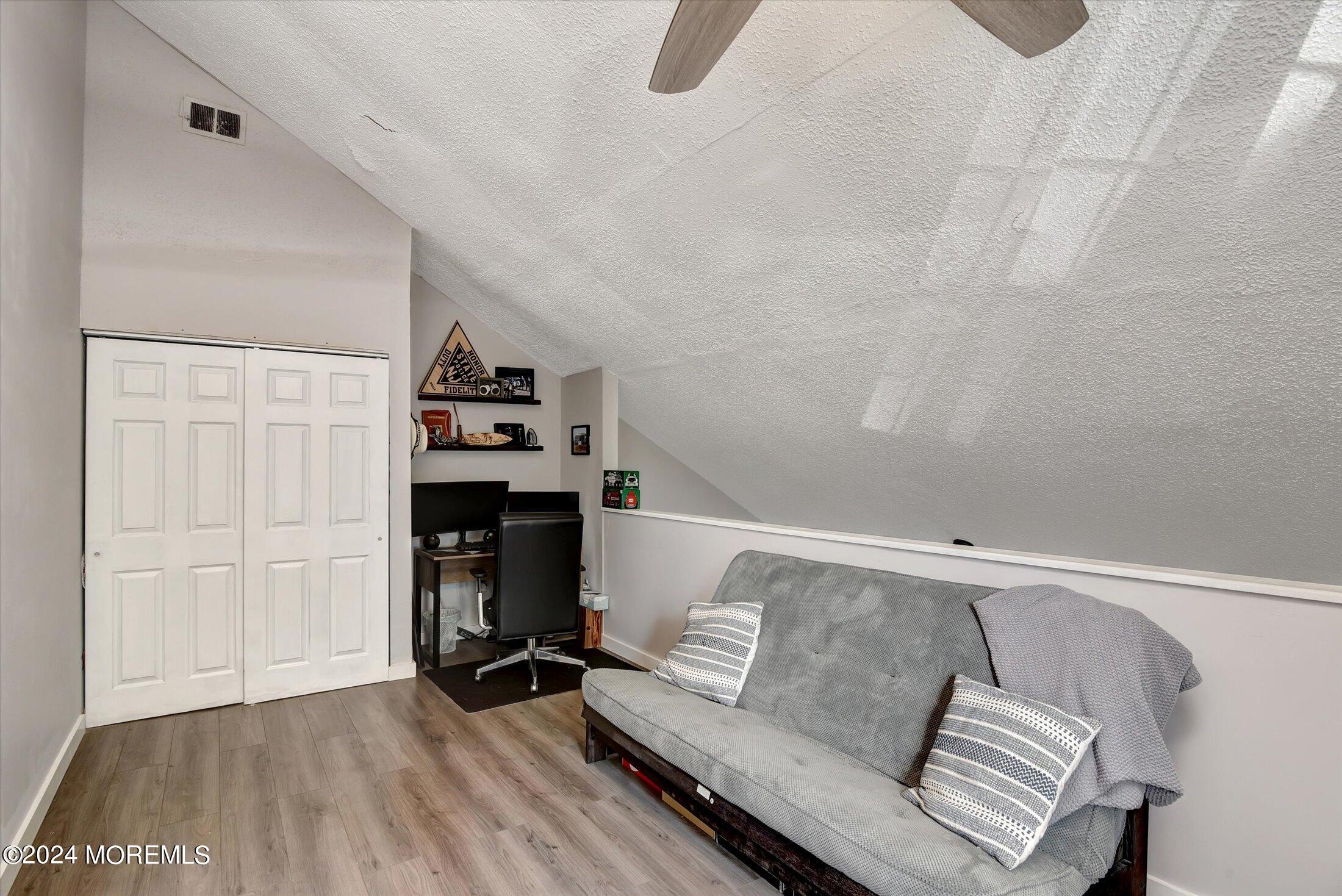 116 Azalea Circle Jackson, NJ 08527 - Photo 21 of 37 a living room with furniture and a fireplace