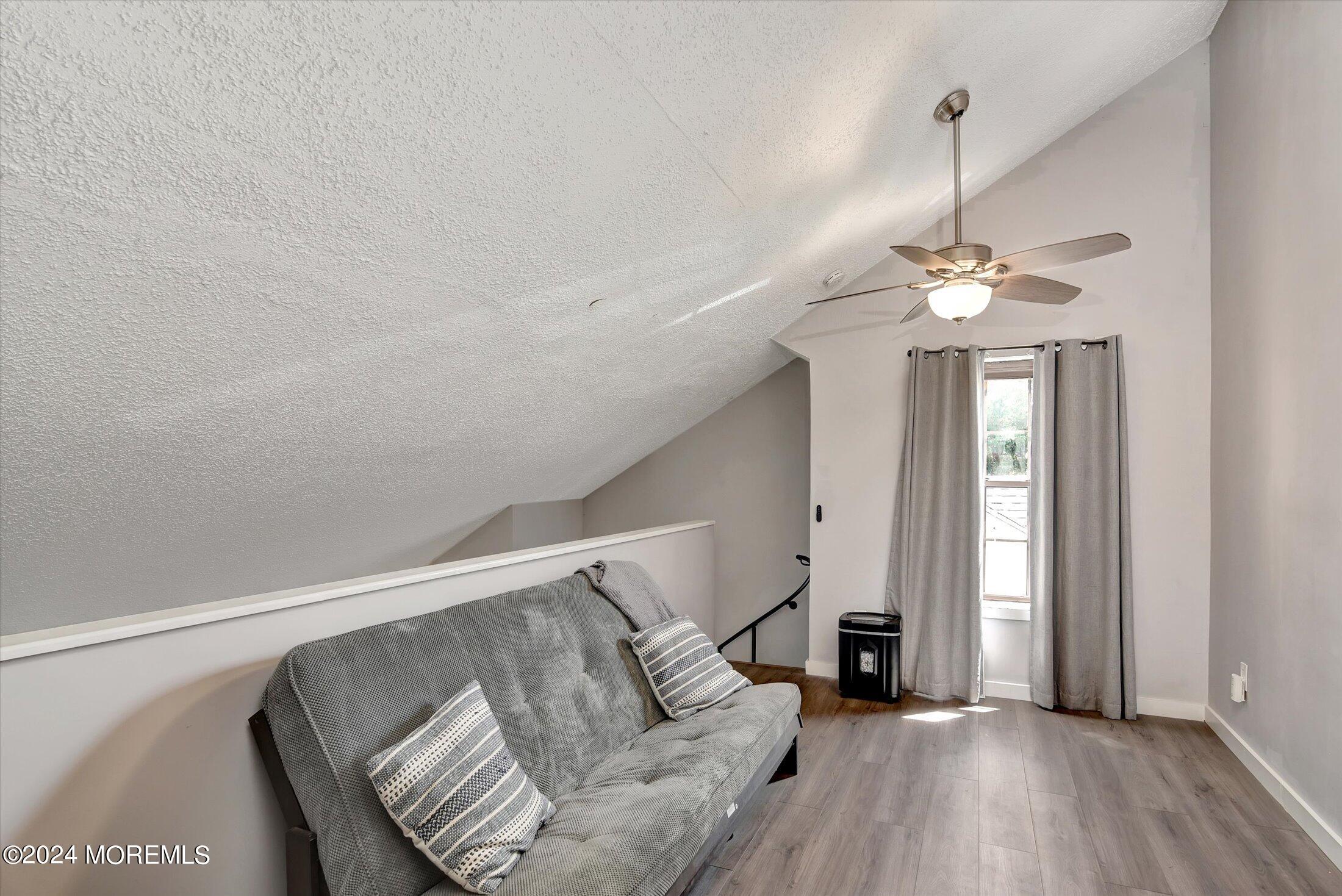 116 Azalea Circle Jackson, NJ 08527 - Photo 22 of 37 a living room with furniture and a chandelier