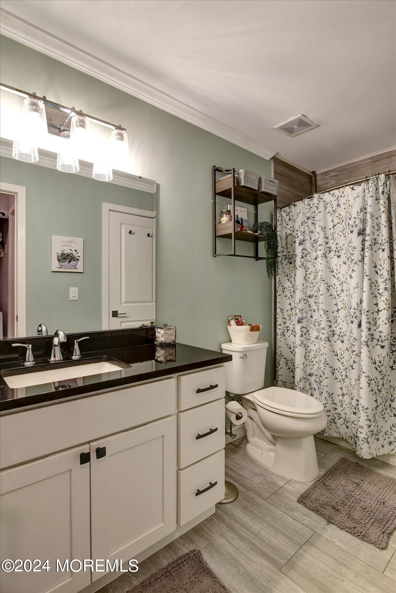 116 Azalea Circle Jackson, NJ 08527 - Photo 25 of 37 a bathroom with a granite countertop toilet sink and mirror