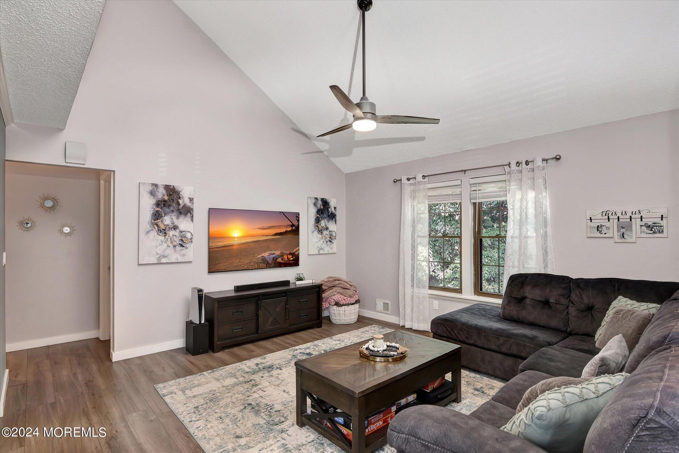 116 Azalea Circle Jackson, NJ 08527 - Photo 3 of 37 a living room with furniture a window and a flat screen tv
