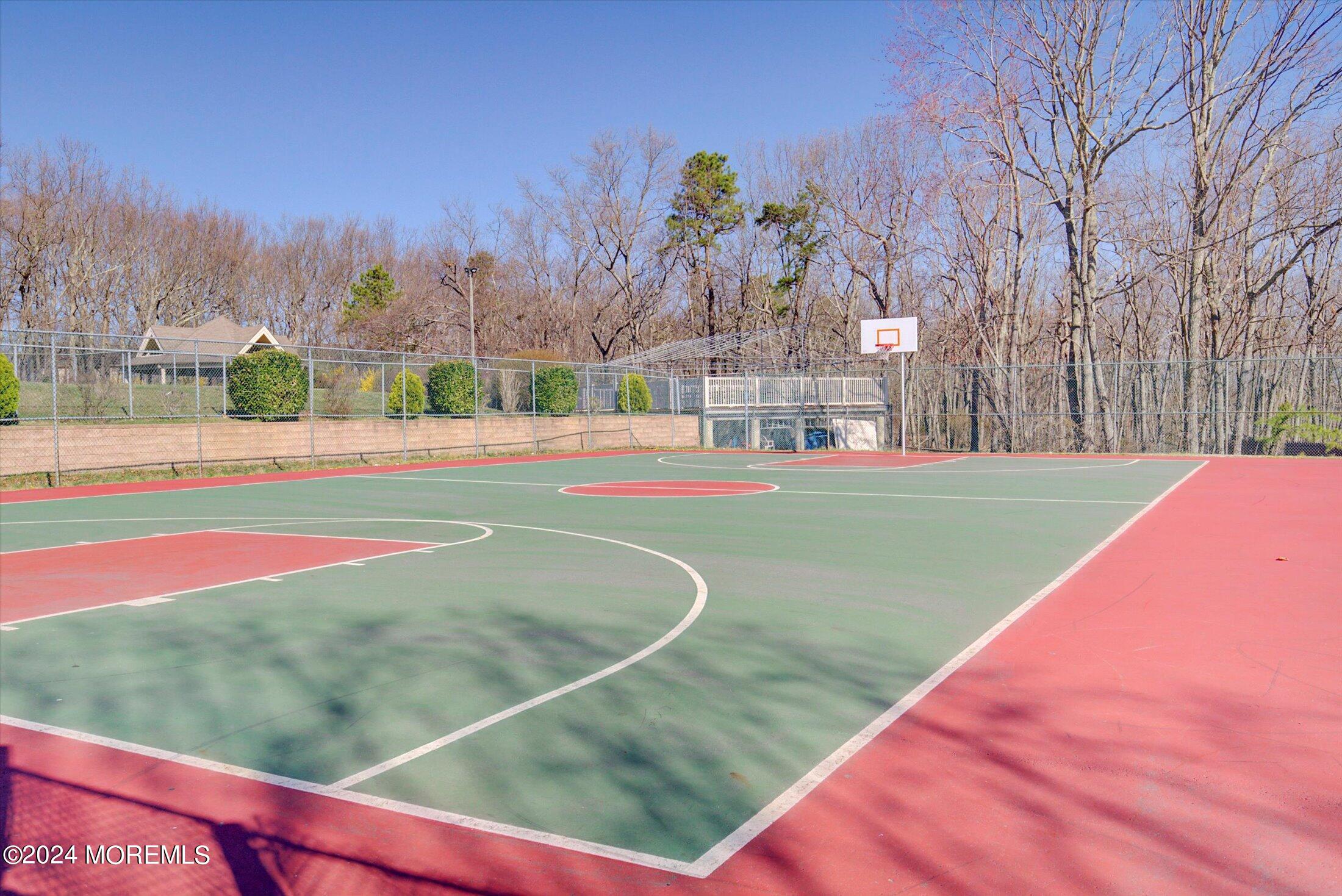 116 Azalea Circle Jackson, NJ 08527 - Photo 35 of 37 a view of a tennis ground with large trees