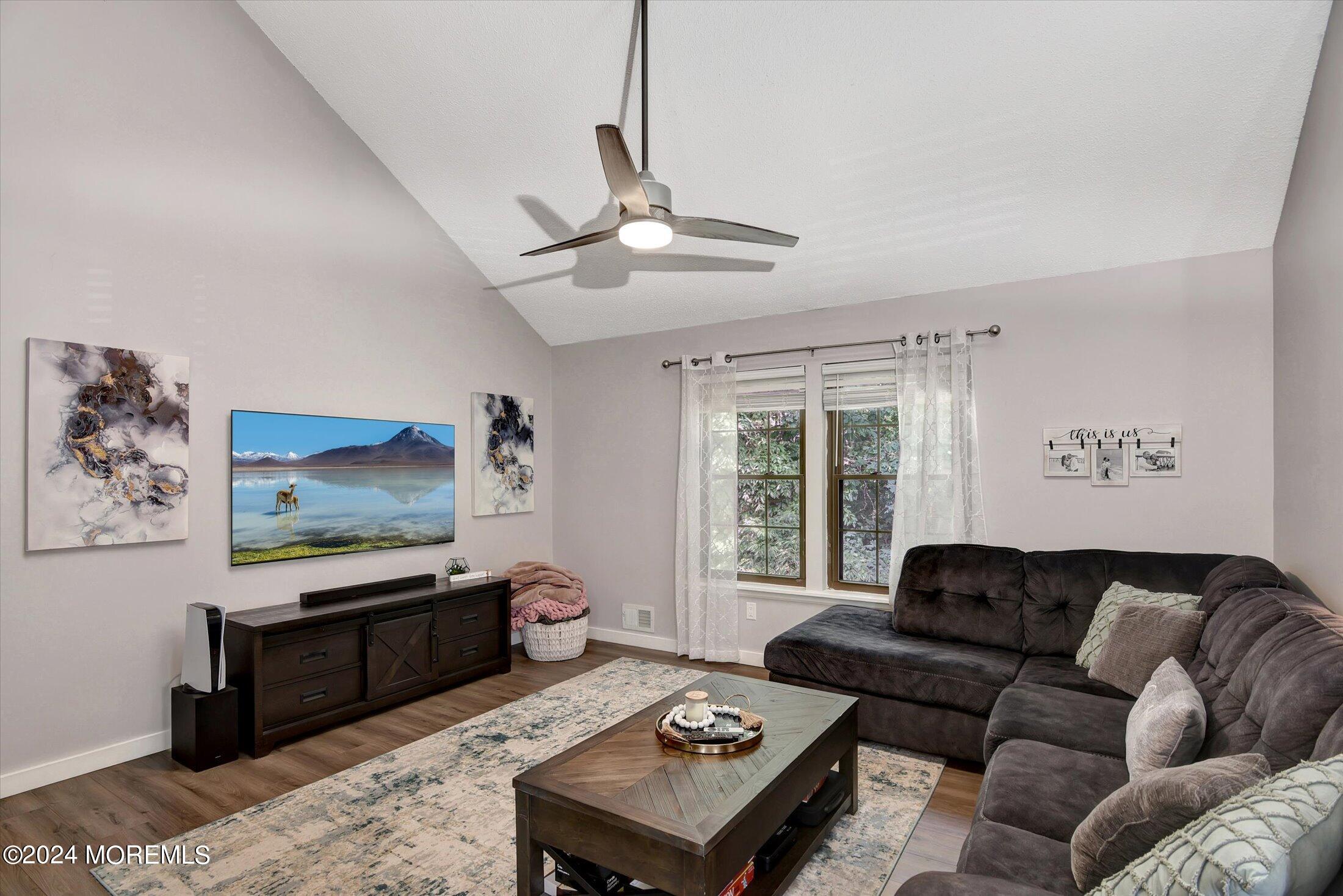 116 Azalea Circle Jackson, NJ 08527 - Photo 4 of 37 a living room with furniture ceiling fan and a window