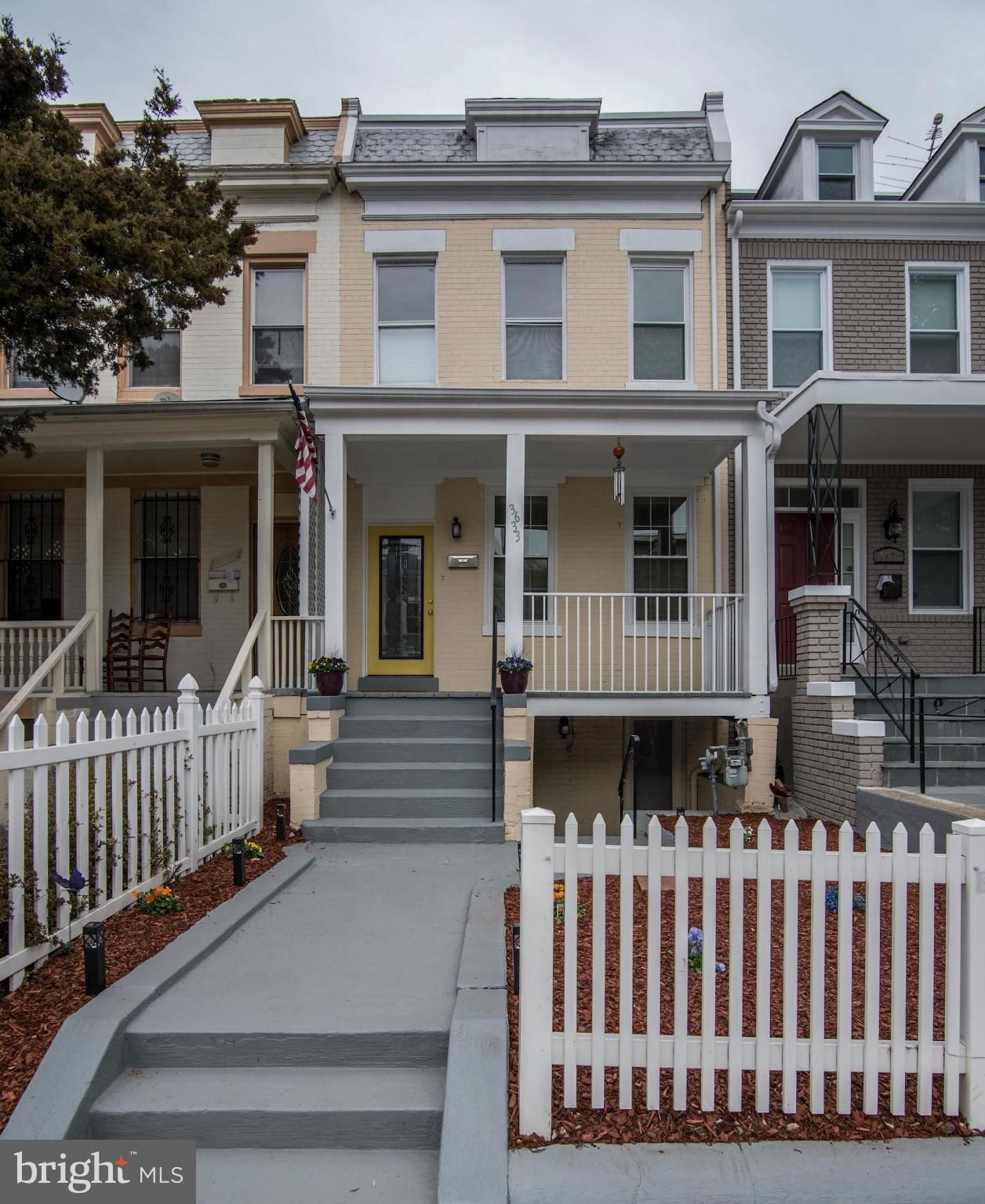 3633 13th Street Northwest Washington, DC 20010 - Photo 2 of 30 a view of a brick house with a small deck