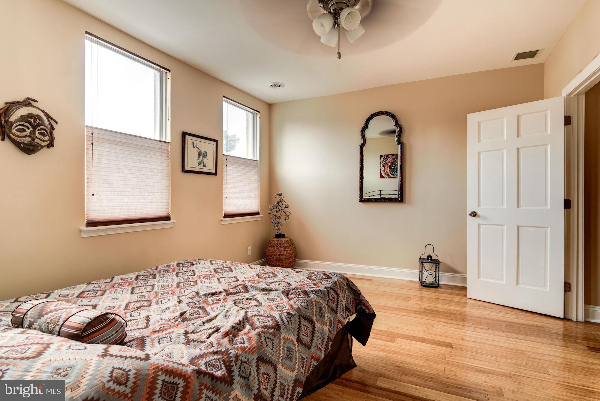3633 13th Street Northwest Washington, DC 20010 - Photo 16 of 30 a bedroom with a bed and a painting on the wall