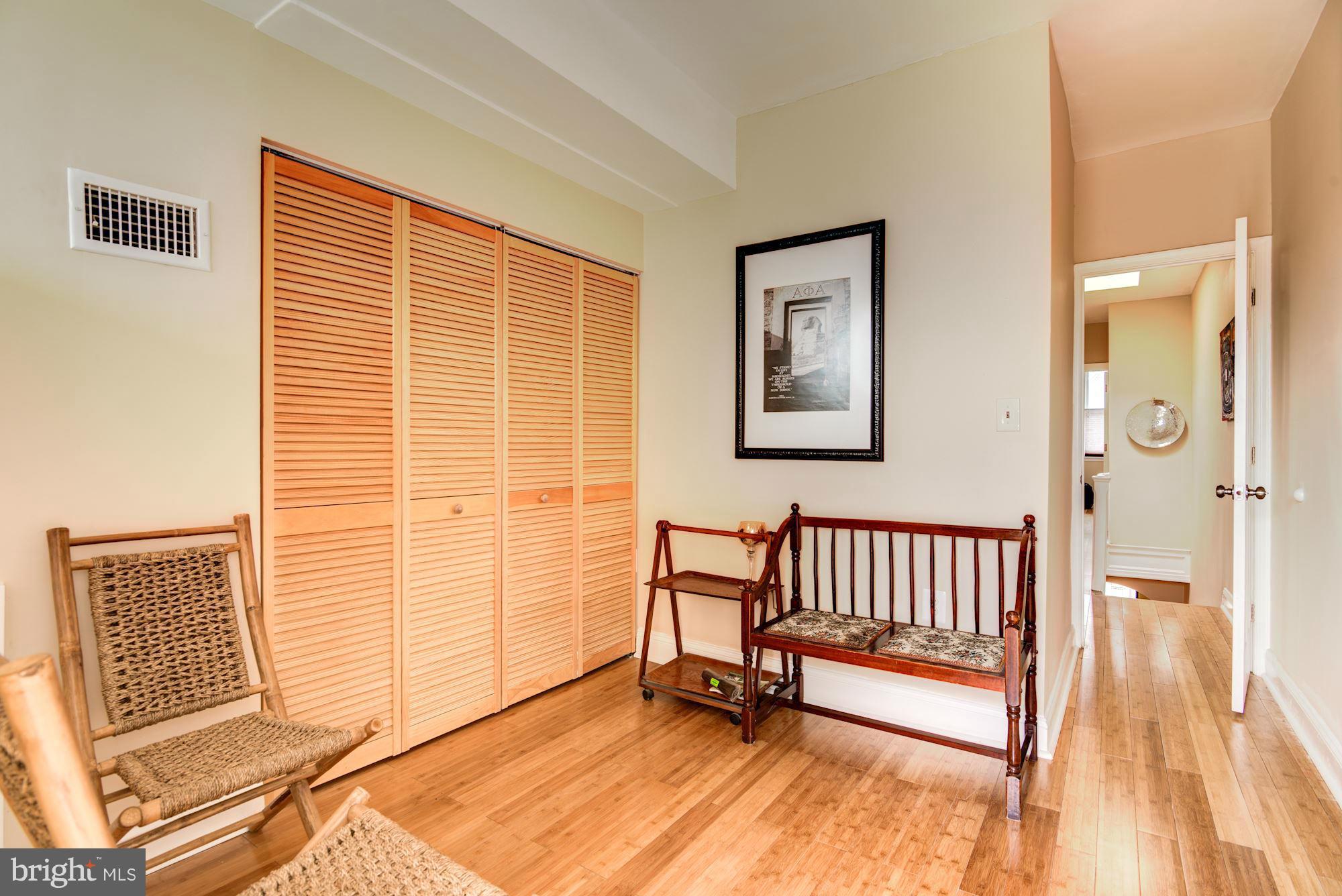 3633 13th Street Northwest Washington, DC 20010 - Photo 19 of 30 a view of a bedroom with wooden floor and a sink