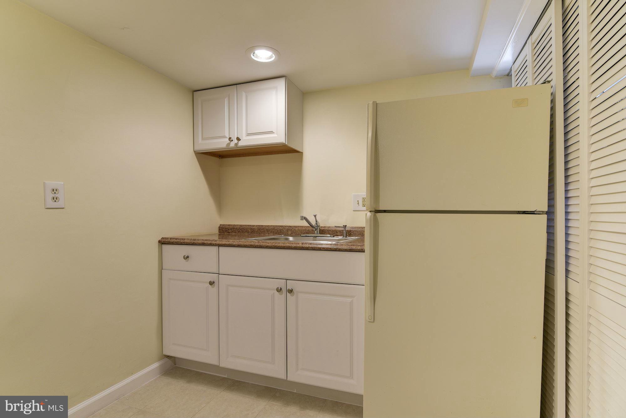 3633 13th Street Northwest Washington, DC 20010 - Photo 26 of 30 a kitchen with a refrigerator and a sink