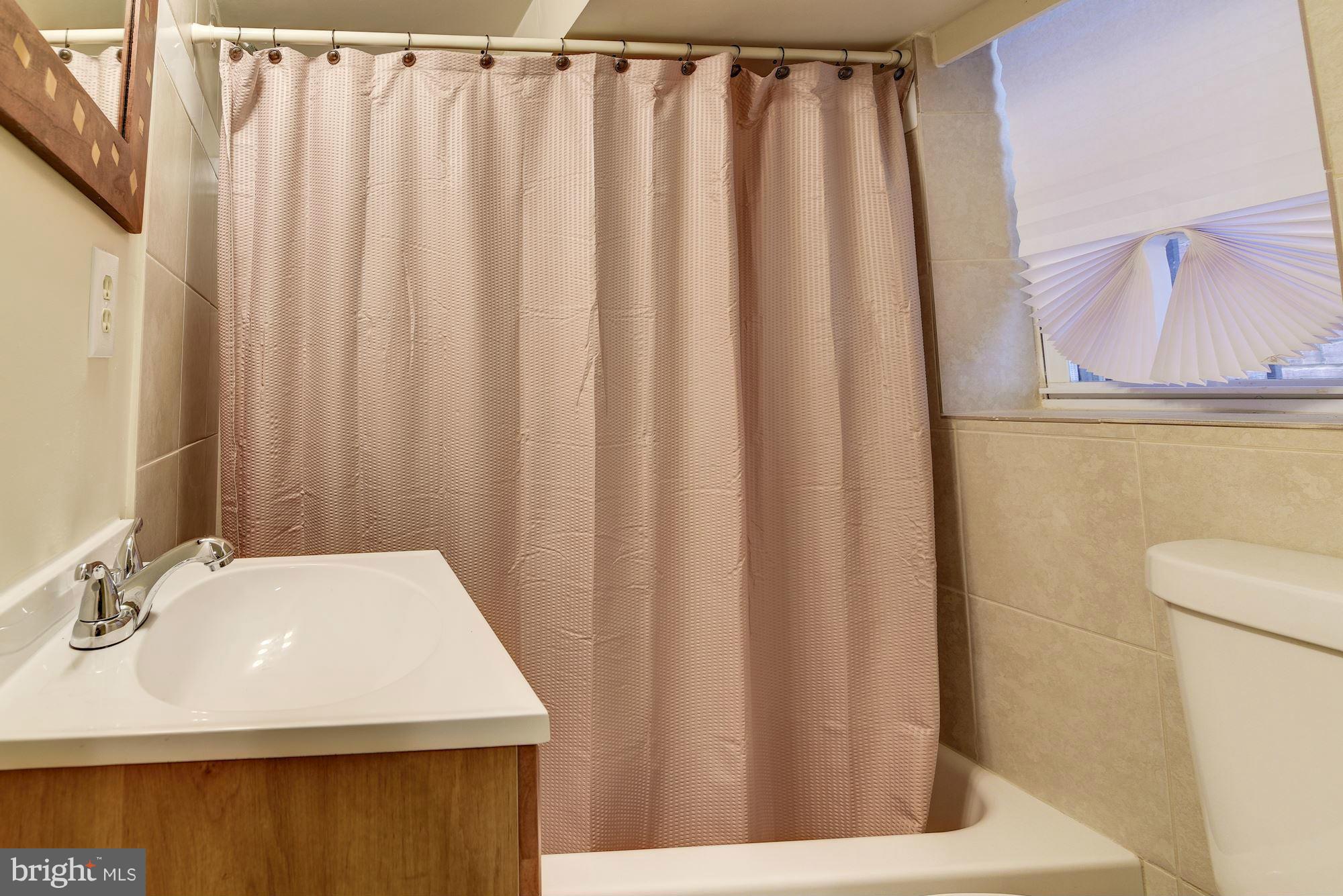 3633 13th Street Northwest Washington, DC 20010 - Photo 27 of 30 a bathroom with a sink and a mirror