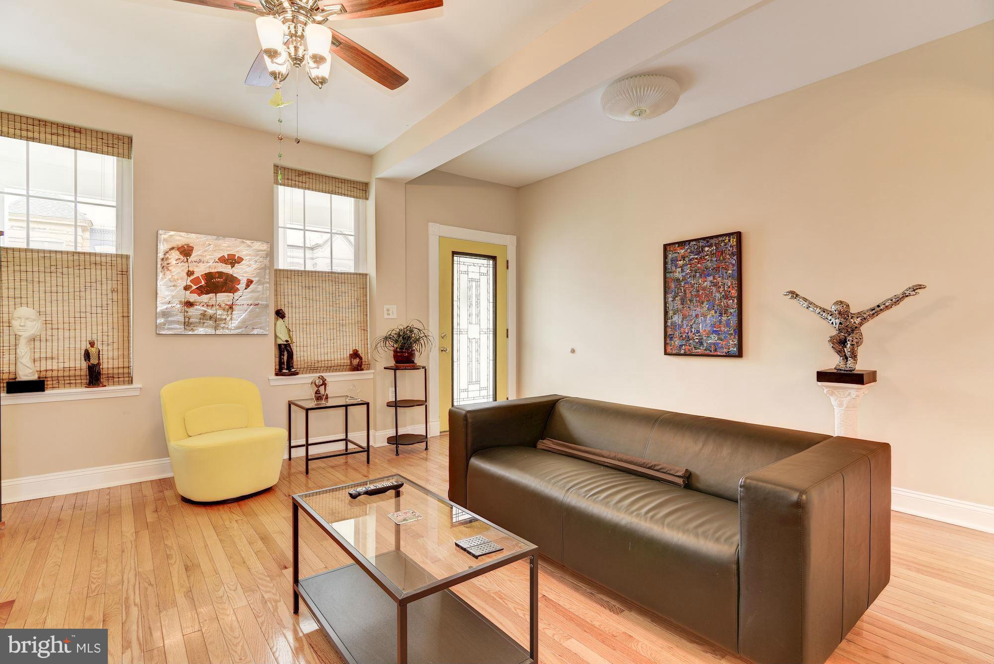 3633 13th Street Northwest Washington, DC 20010 - Photo 6 of 30 a living room with furniture and a chandelier