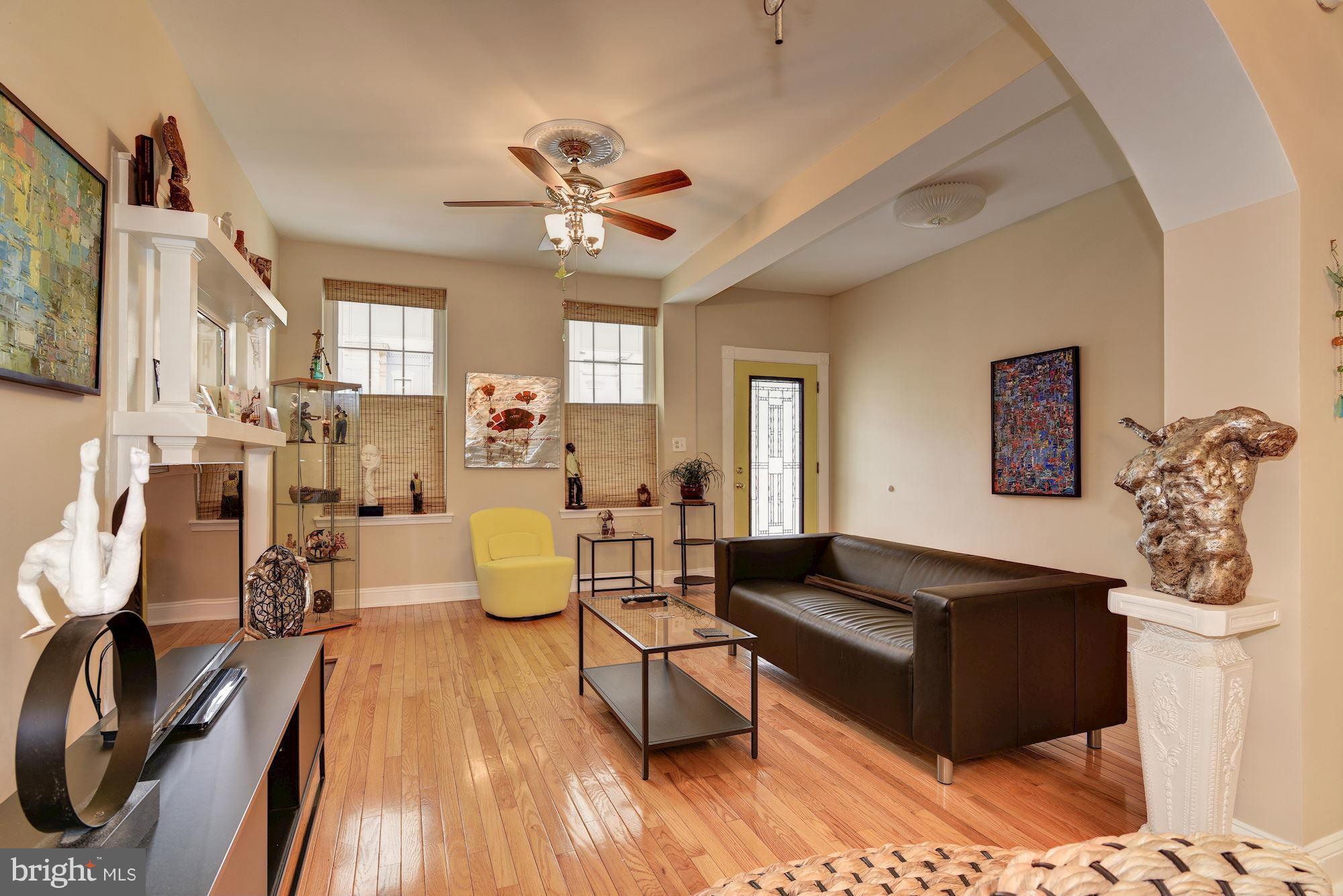 3633 13th Street Northwest Washington, DC 20010 - Photo 7 of 30 a living room with furniture and a wooden floor