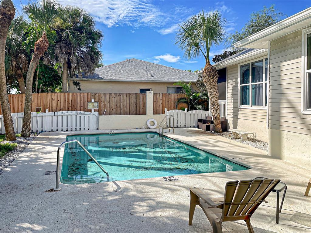 1801 Highland Road Osprey, FL 34229 - Photo 40 of 40 a view of backyard with a patio and a garden