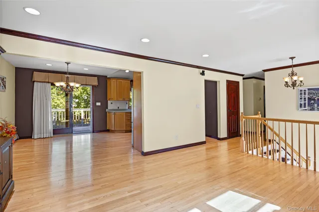 a view of an entryway with wooden floor