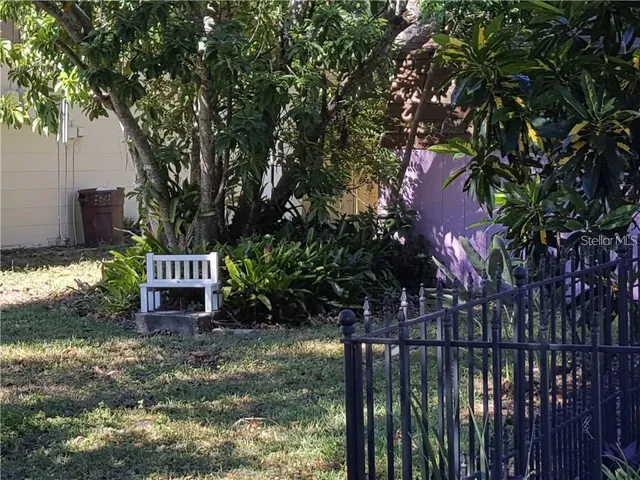 a view of a patio with a table and chairs