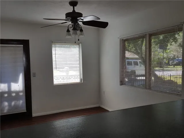 a view of a living room a window and a chandelier