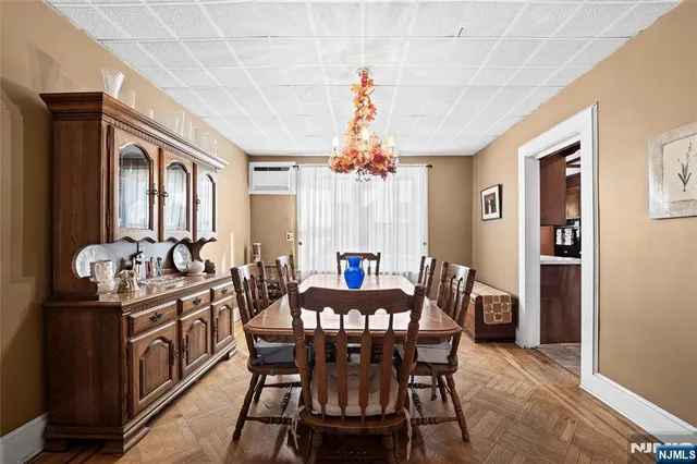 a view of a dining room with furniture and window