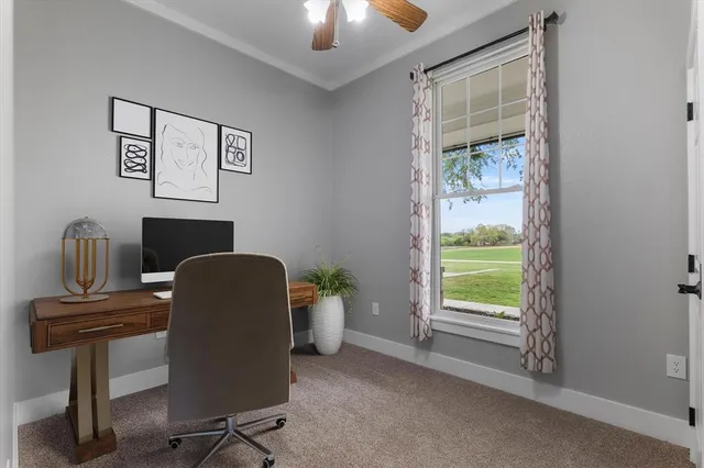 a work room with furniture and a window