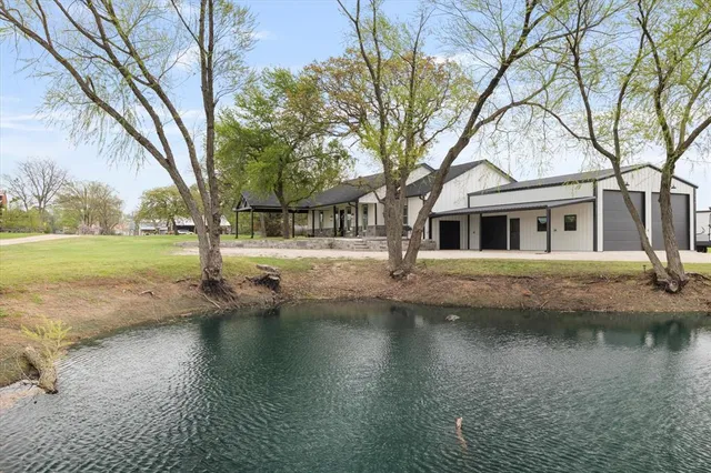 a view of a swimming pool with a yard