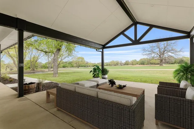a view of swimming pool with outdoor seating