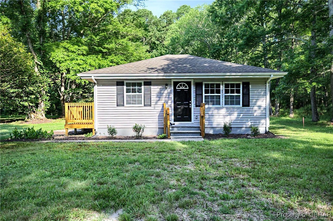 830 Glebe Road Mathews, VA 23109 - Photo 1 of 17 a view of a house with a yard