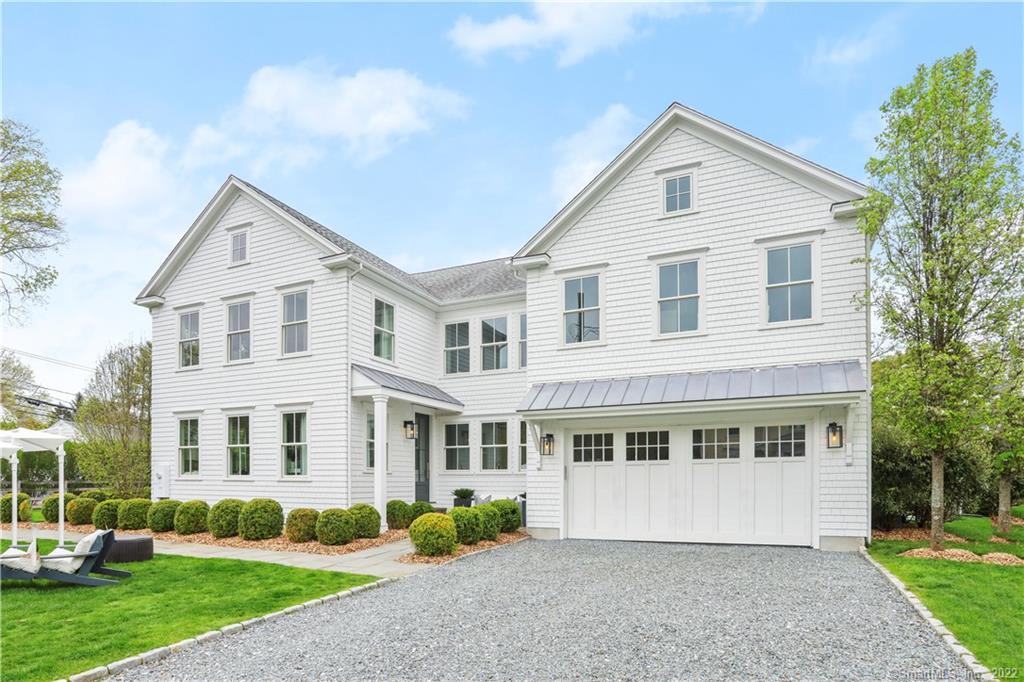 1 Sniffen Road Westport, CT 06880 - Photo 1 of 1 a front view of a house with a garden