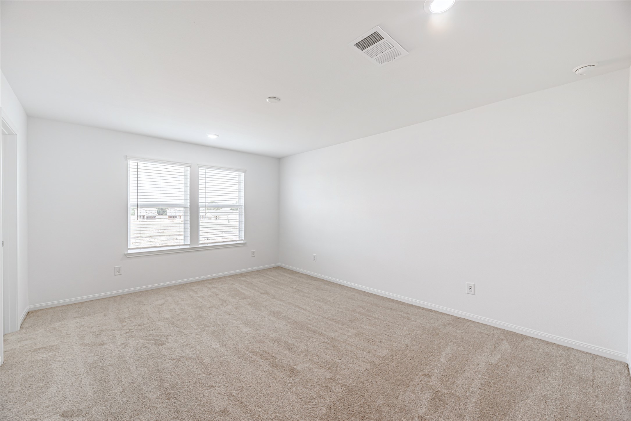 23422 Wagon Cart Road Hockley, TX 77447 - Photo 13 of 28 an empty room with a window